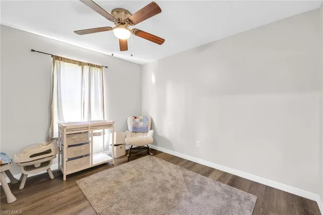 a view of livingroom with hardwood floor and ceiling fan