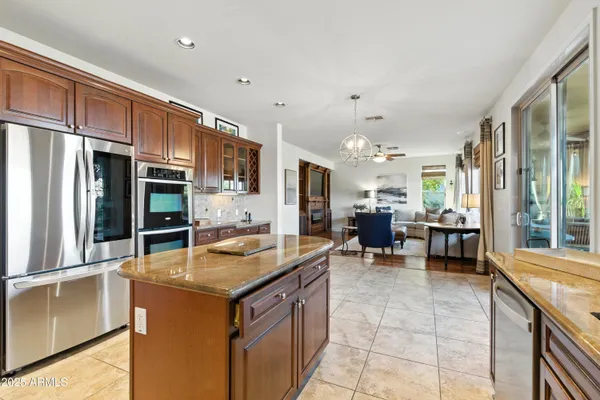 a view of a dining room with furniture wooden floor and chandelier