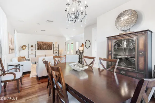 a spacious bedroom with a bed wooden floor and window
