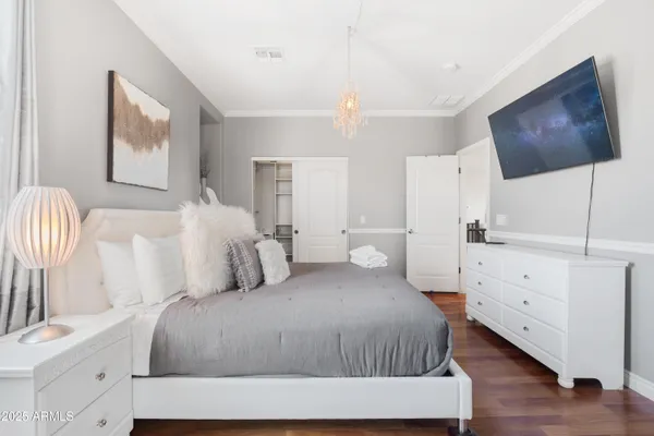a bathroom with a granite countertop sink toilet a mirror and shower curtain