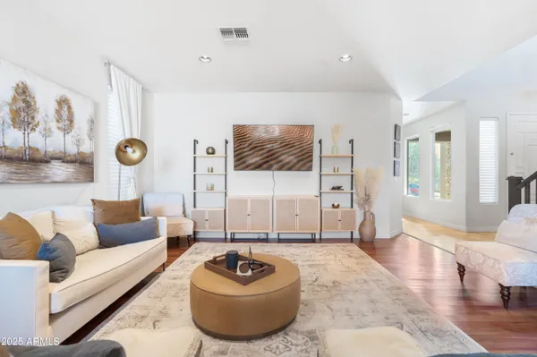 a living room with furniture and a rug