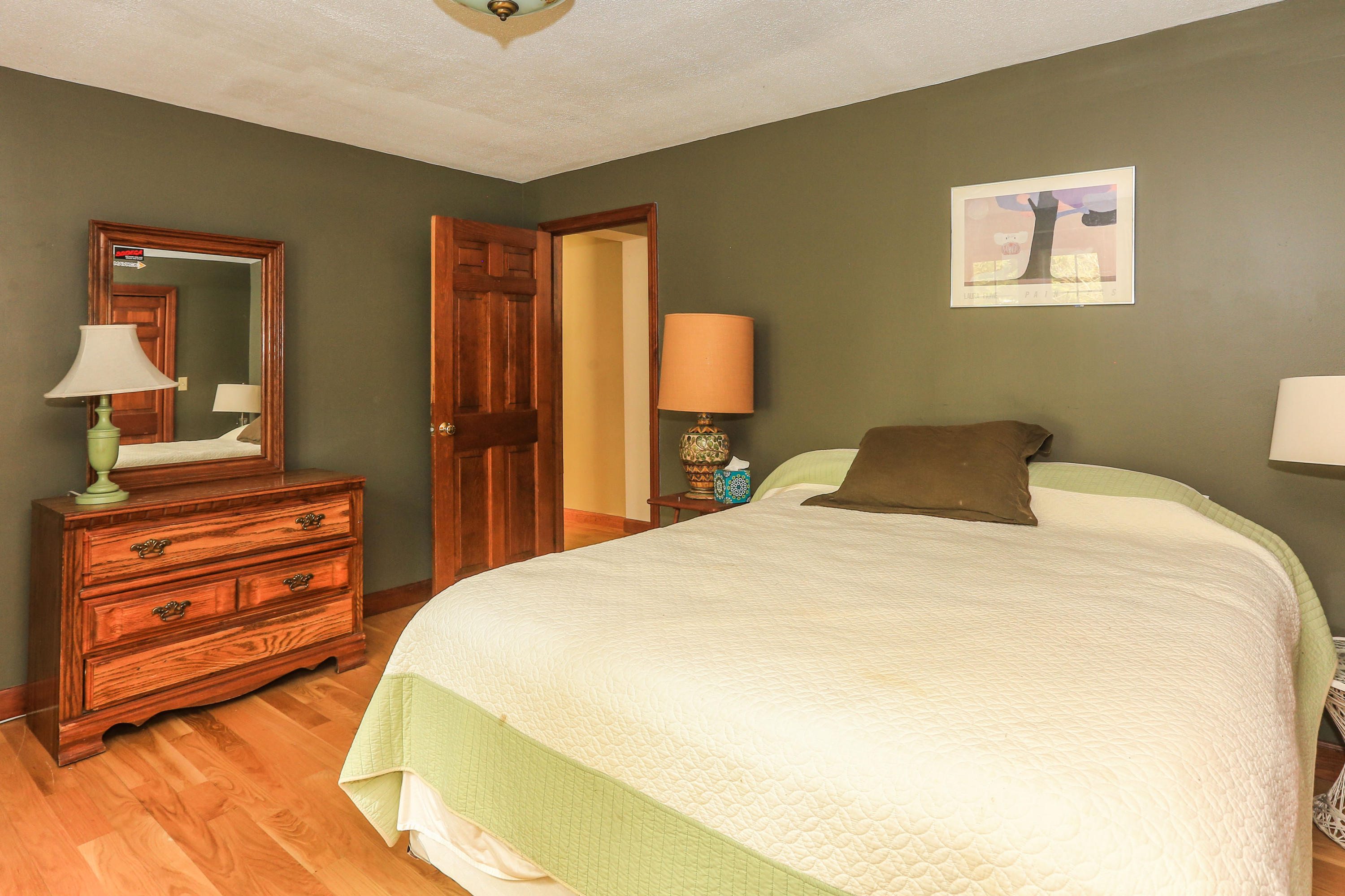 123 Great Neck Road Wareham, MA 02571 - Photo 8 of 17 a bedroom with a bed and wooden floor