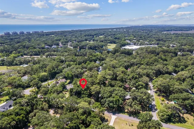 a view of a green field with lots of bushes