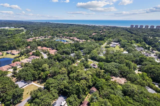 an aerial view of a city and trees