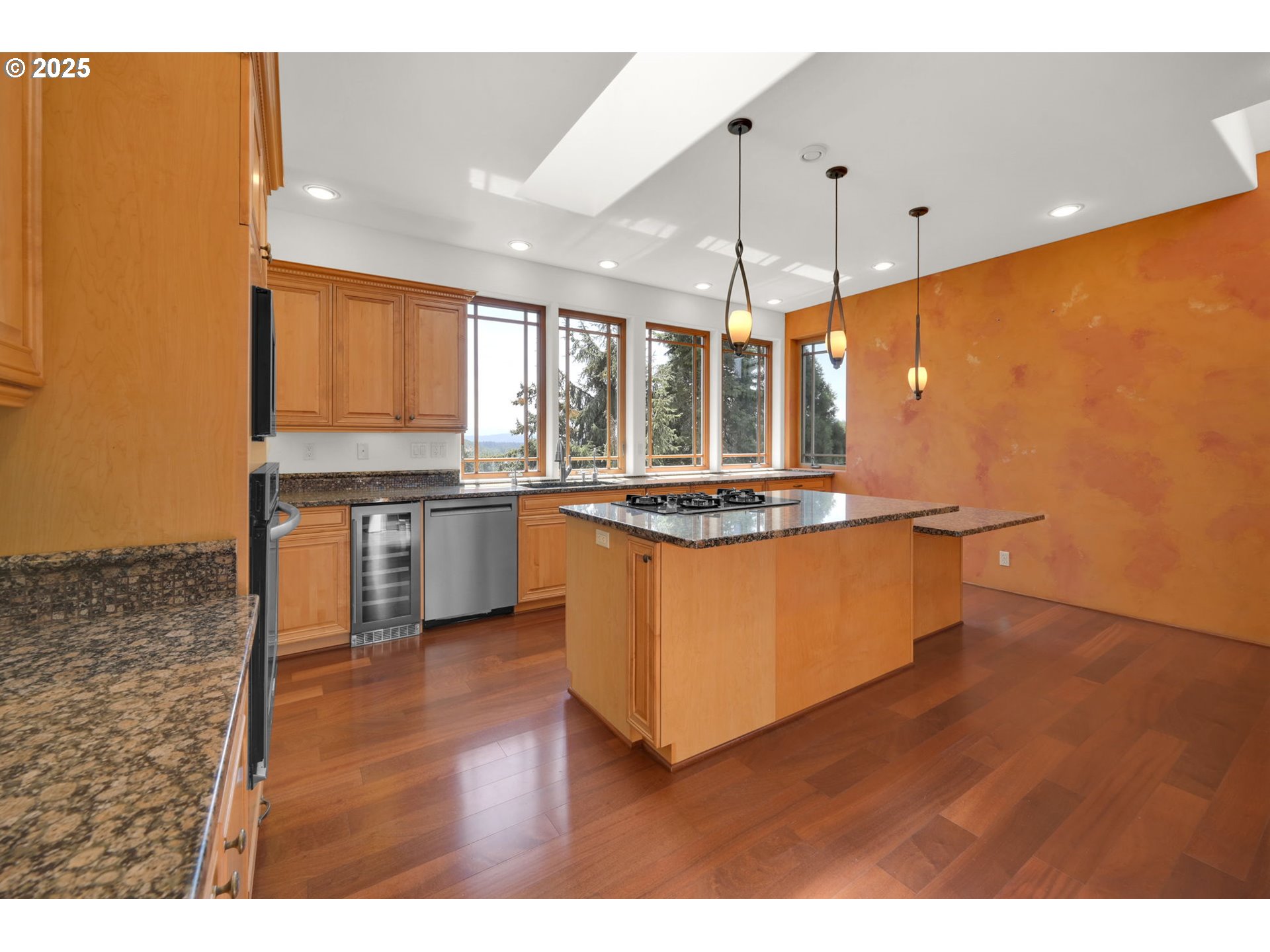 835 Willacade Court Springfield, OR 97477 - Photo 15 of 48 a kitchen with stainless steel appliances granite countertop a stove a sink and a microwave