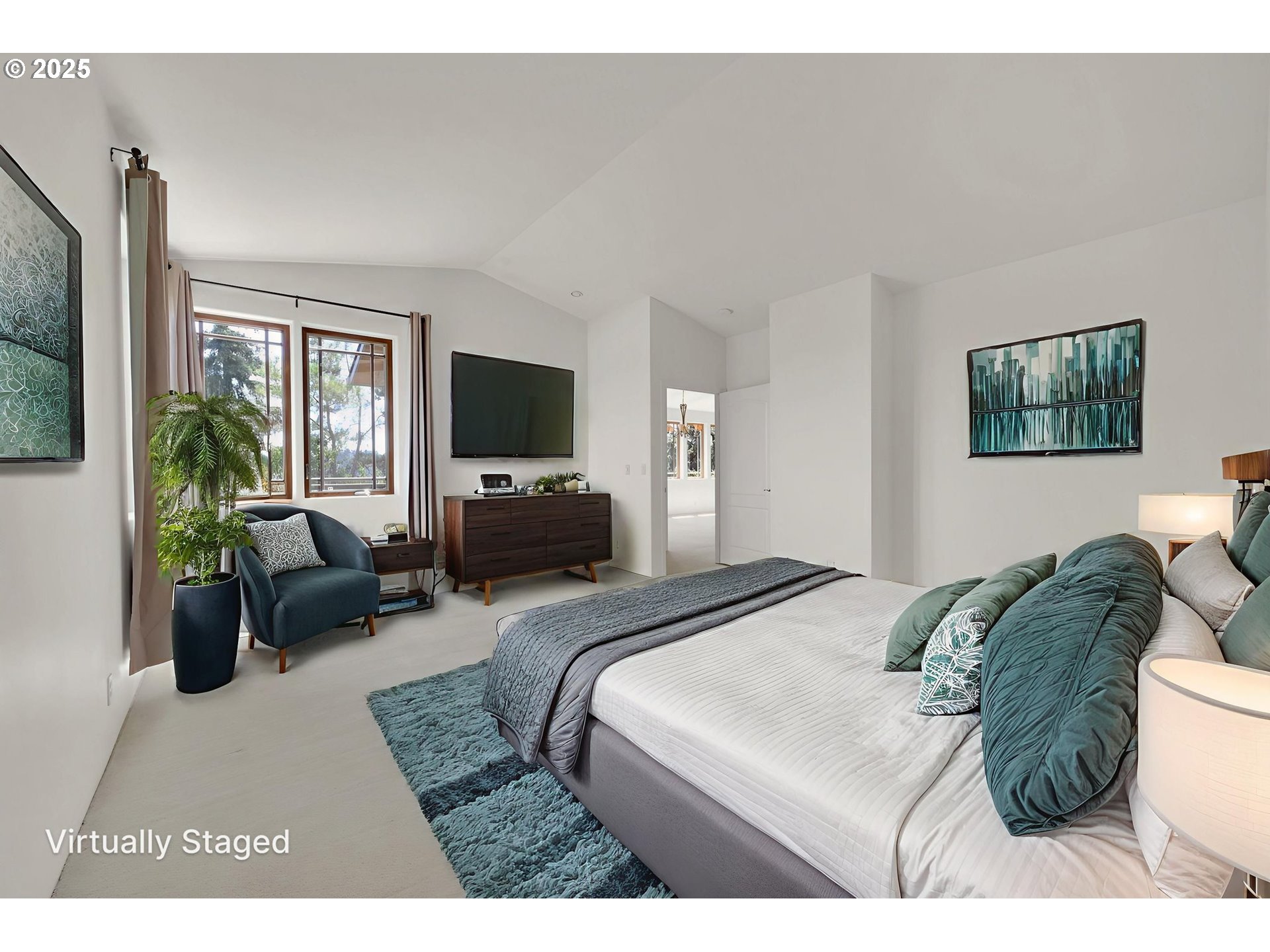 835 Willacade Court Springfield, OR 97477 - Photo 19 of 48 a bedroom with a bed a couch and a flat tv screen on the dresser