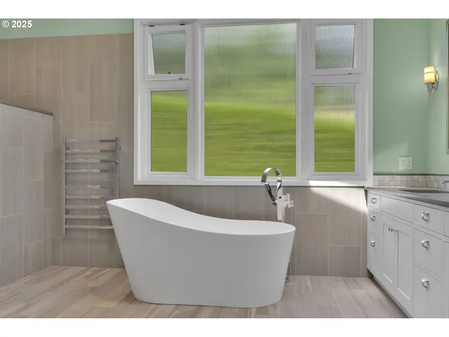 a view of a bathtub in a bathroom