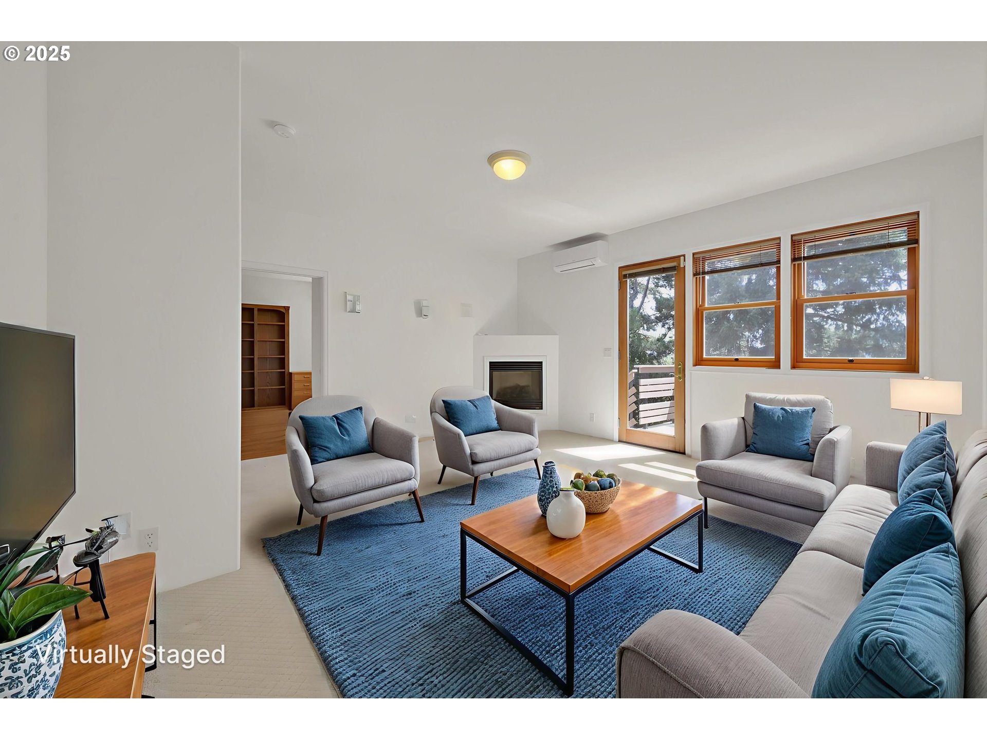 835 Willacade Court Springfield, OR 97477 - Photo 24 of 48 a living room with furniture and a flat screen tv