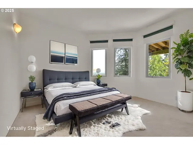 a bedroom with a bed and a potted plant