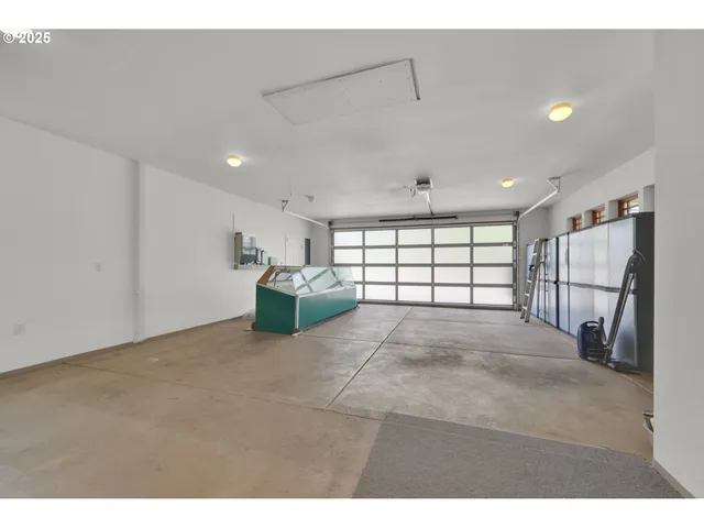 a view of a livingroom with furniture and a window