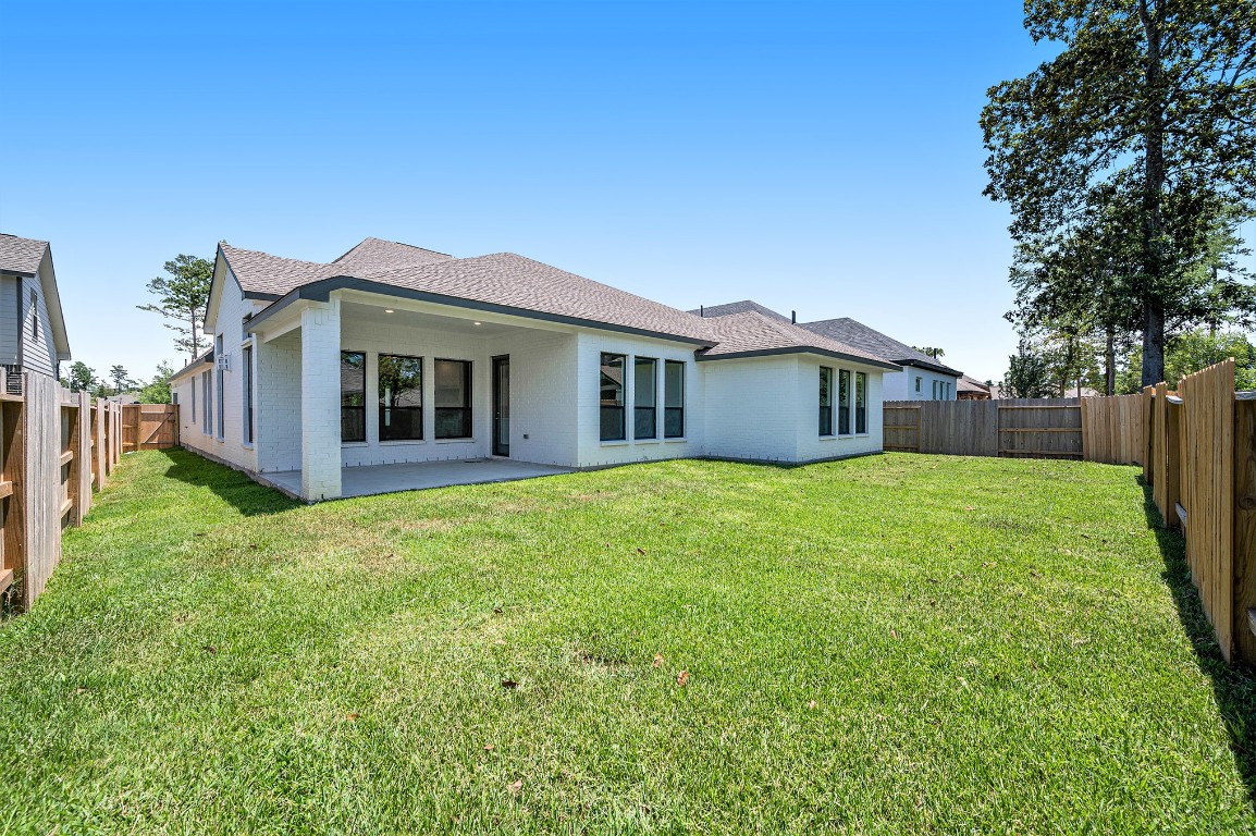 132 Meadow Beauty Lane Georgetown, TX 78633 - Photo 14 of 19 a view of a house with a backyard