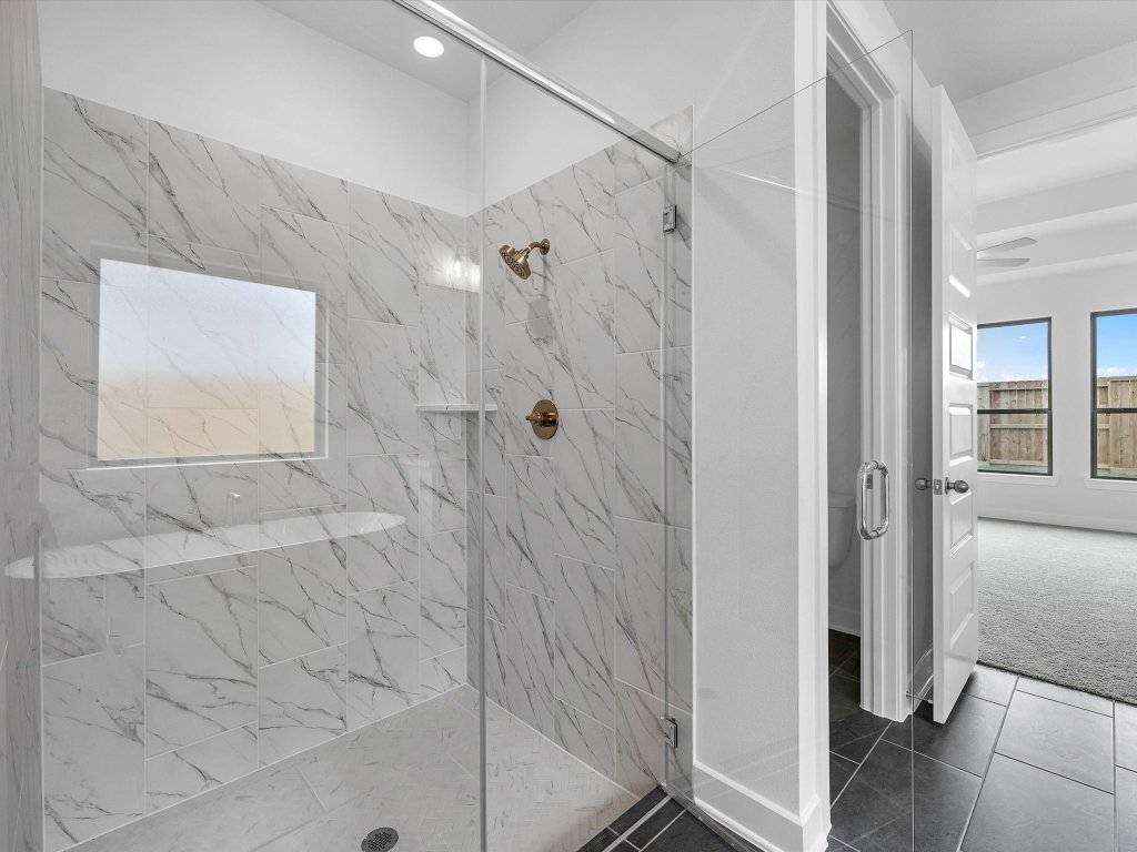 132 Meadow Beauty Lane Georgetown, TX 78633 - Photo 9 of 19 a bathroom with a shower