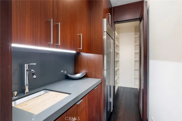 a room with stainless steel appliances lots of counter space and breakfast area