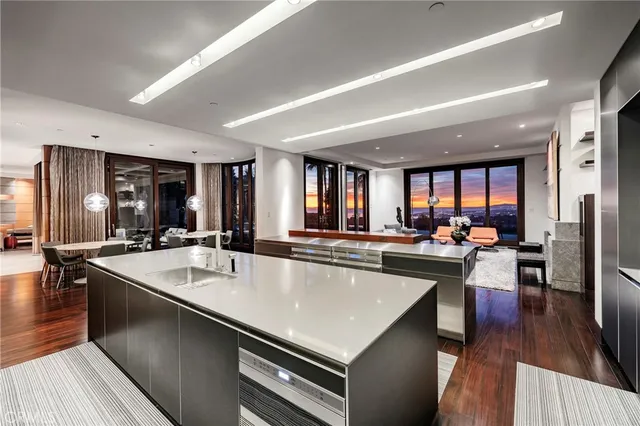 a view of a a dining room with furniture window and wooden floor