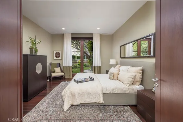 a spacious bathroom with a tub sink and mirror
