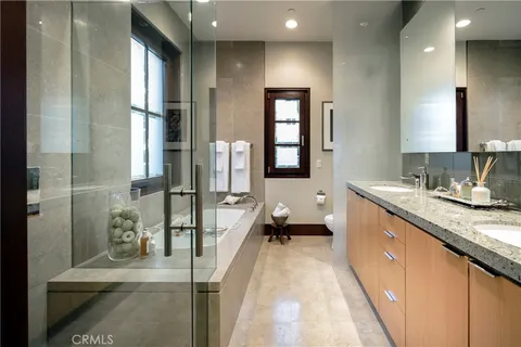 a kitchen with stainless steel appliances granite countertop a stove and a wooden floors