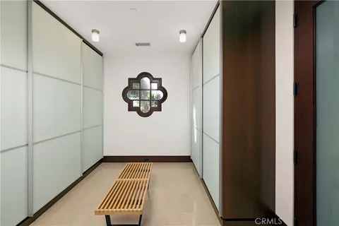 a outdoor dining space with furniture and a chandelier