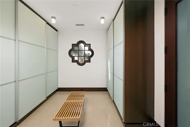 a outdoor dining space with furniture and a chandelier