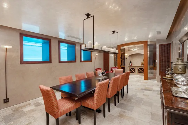 a room with gym equipment and mirrors