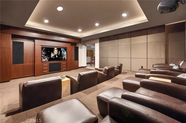 a room with pool table flat screen tv