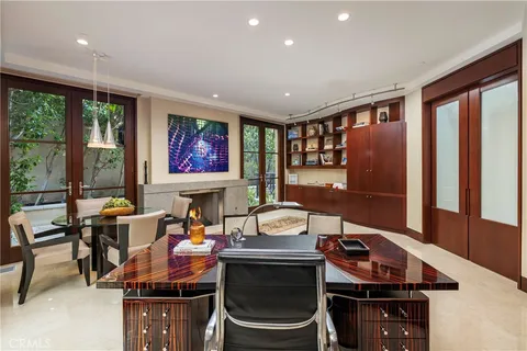 a living room with furniture a rug and a large window