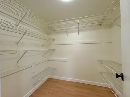 a view of a room with racks on the wall
