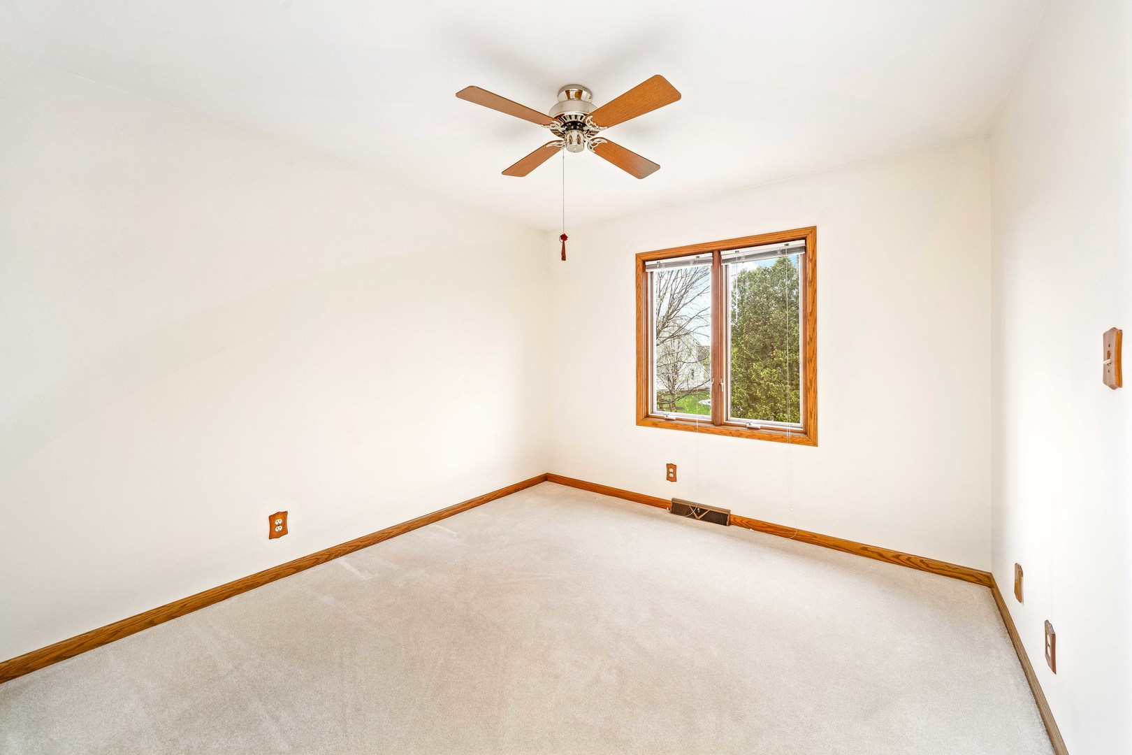 1027 Foxpointe Drive Sycamore, IL 60178 - Photo 28 of 36 a view of a room with a window and a ceiling fan
