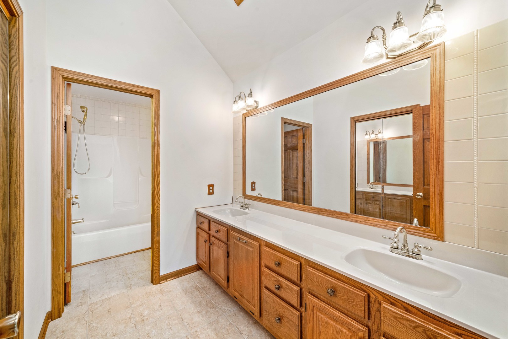1027 Foxpointe Drive Sycamore, IL 60178 - Photo 32 of 36 a spacious bathroom with double vanity and a mirror