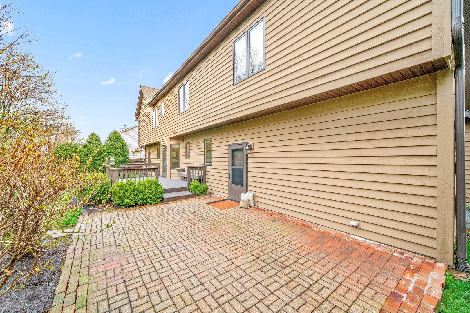 1027 Foxpointe Drive Sycamore, IL 60178 - Photo 5 of 36 a view of a backyard with a garden