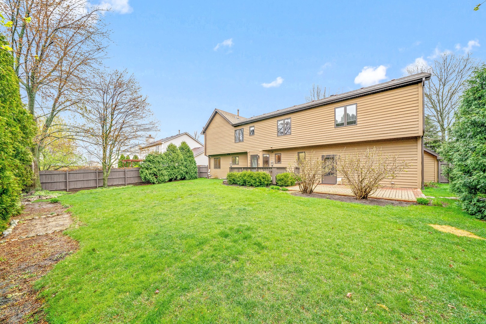 1027 Foxpointe Drive Sycamore, IL 60178 - Photo 6 of 36 a front view of a house with garden
