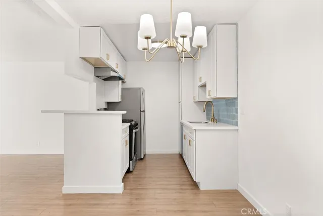 a view of a kitchen from the hallway