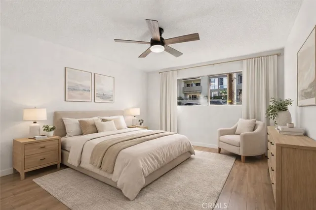 a bedroom with a bed and window