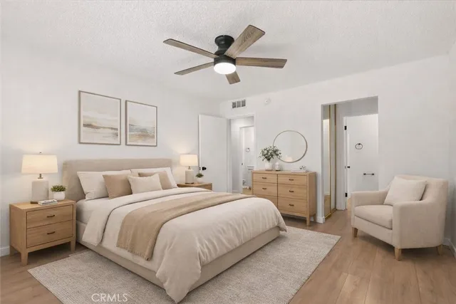 a spacious bedroom with a bed and a couch