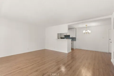 a view of a kitchen with wooden floor