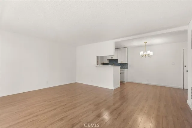 a view of a kitchen with wooden floor
