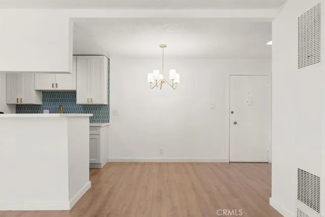a view of cabinets and wooden floor