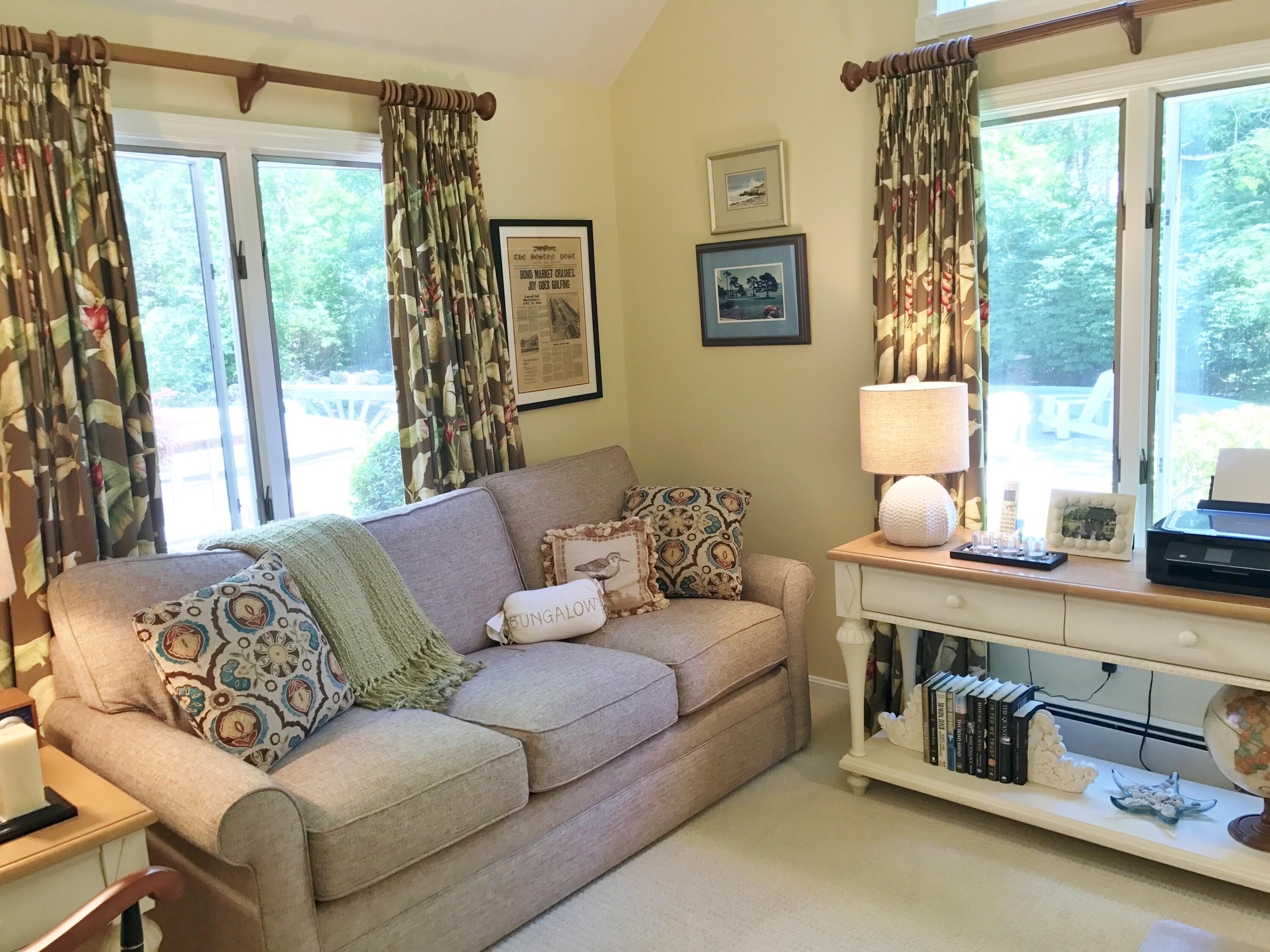 182 Sesuit Neck Road East Dennis, MA 02641 - Photo 15 of 35 a living room with furniture and a large window