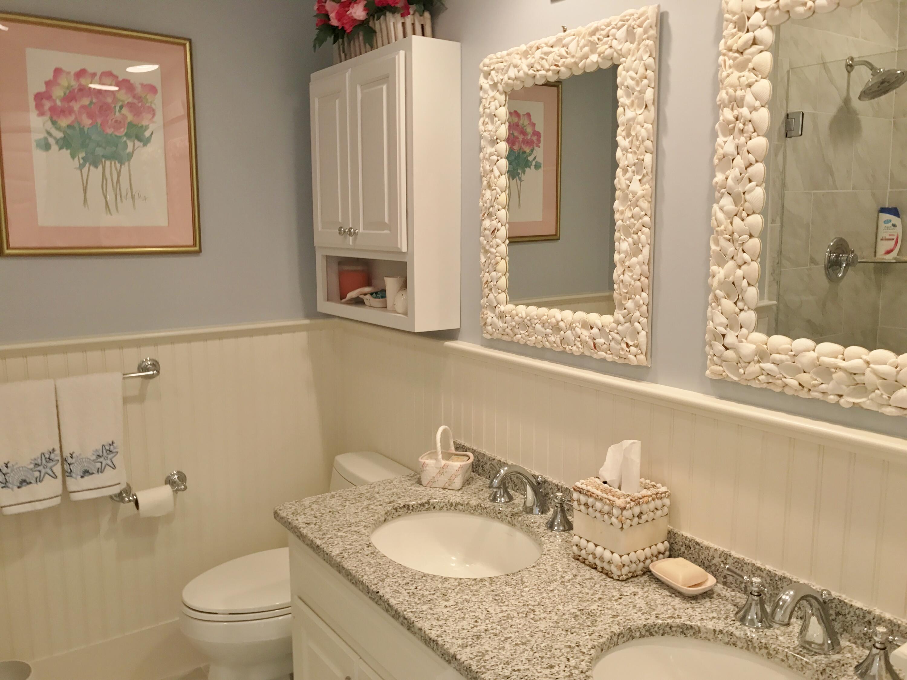 182 Sesuit Neck Road East Dennis, MA 02641 - Photo 27 of 35 a bathroom with a granite countertop sink mirror vanity and toilet