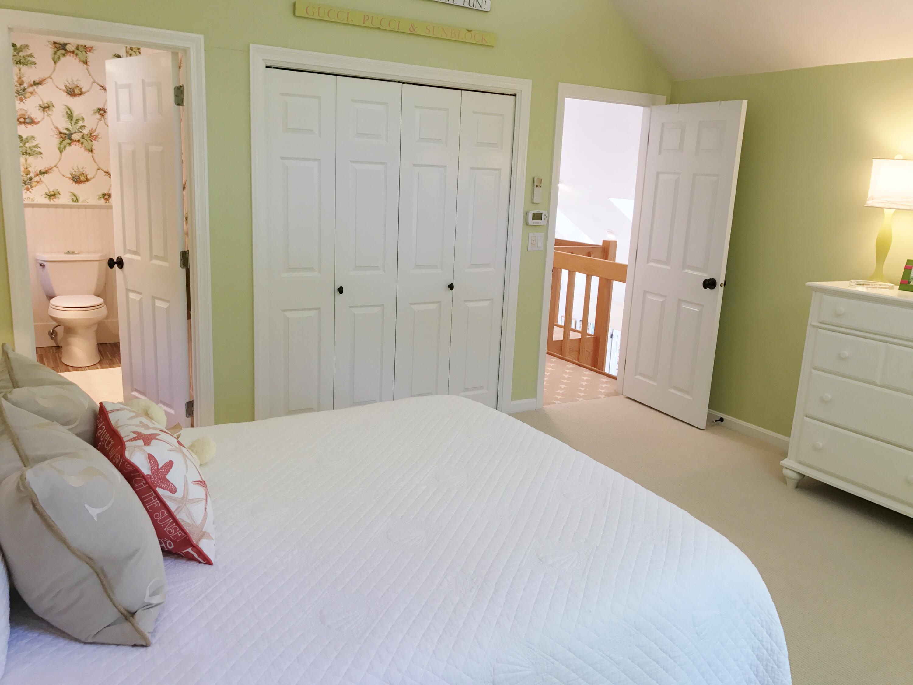 182 Sesuit Neck Road East Dennis, MA 02641 - Photo 29 of 35 a bedroom with a bed and a mirror
