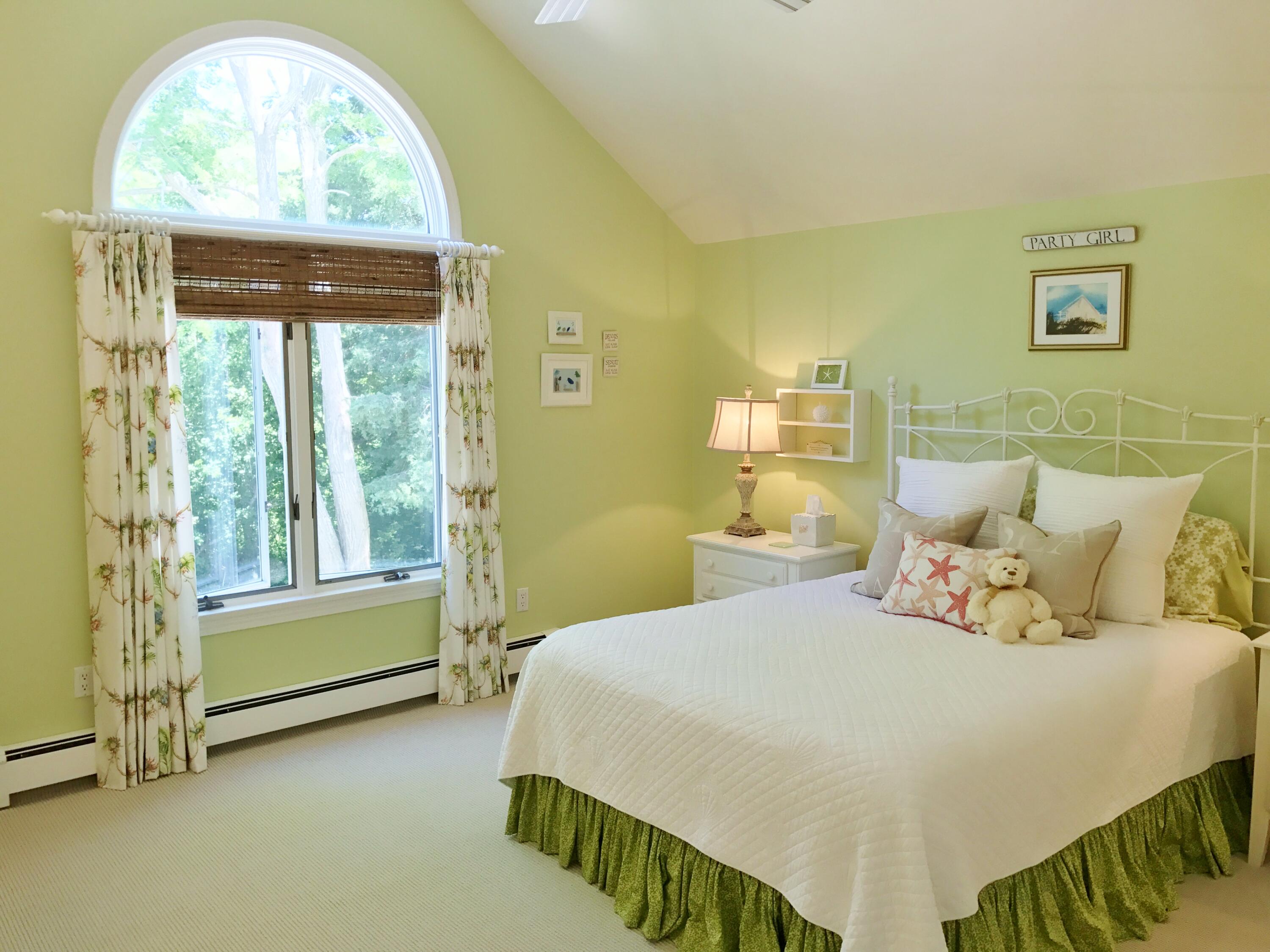 182 Sesuit Neck Road East Dennis, MA 02641 - Photo 30 of 35 a bedroom with a bed and a painting on the wall