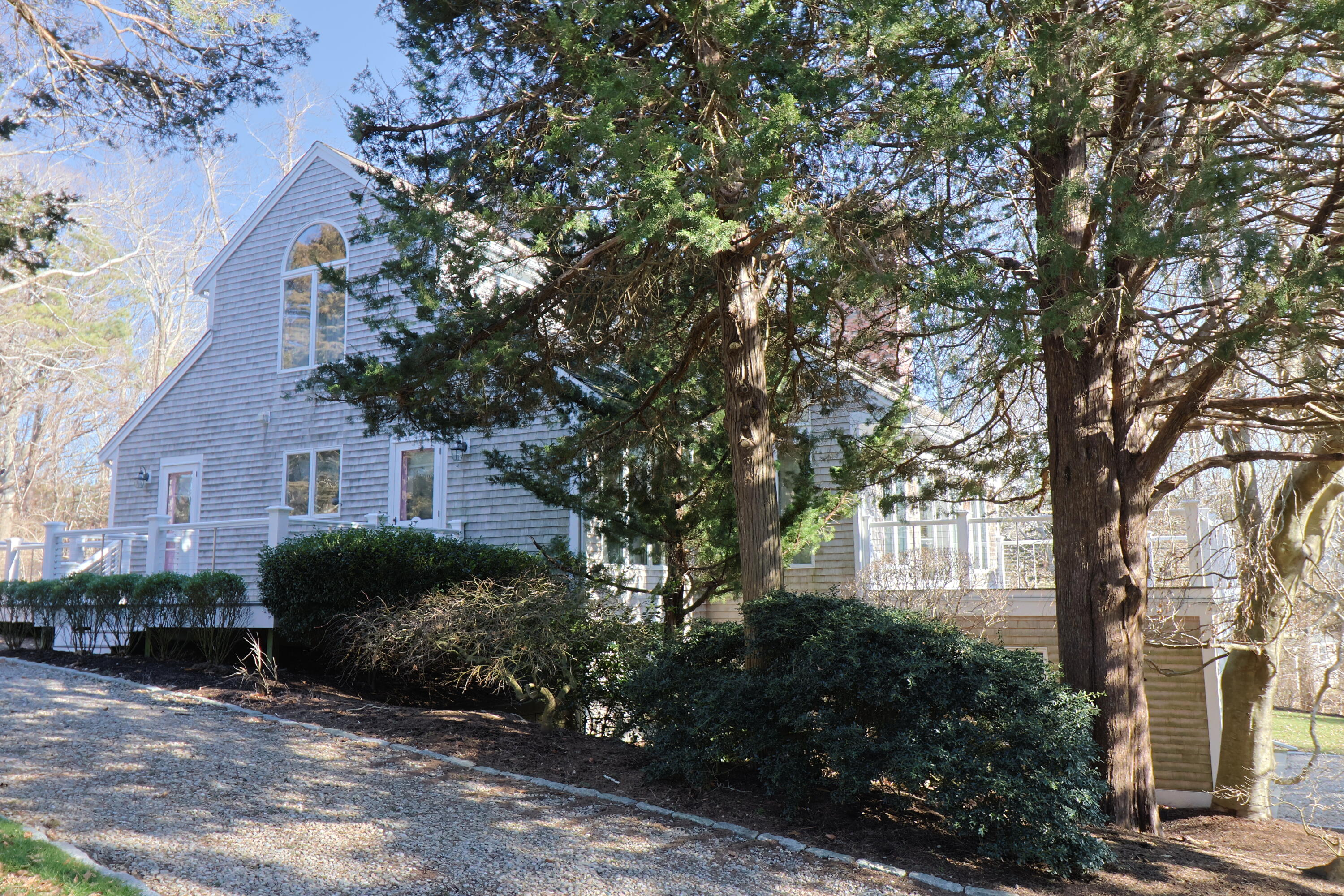 182 Sesuit Neck Road East Dennis, MA 02641 - Photo 3 of 35 a front view of a house with a garden