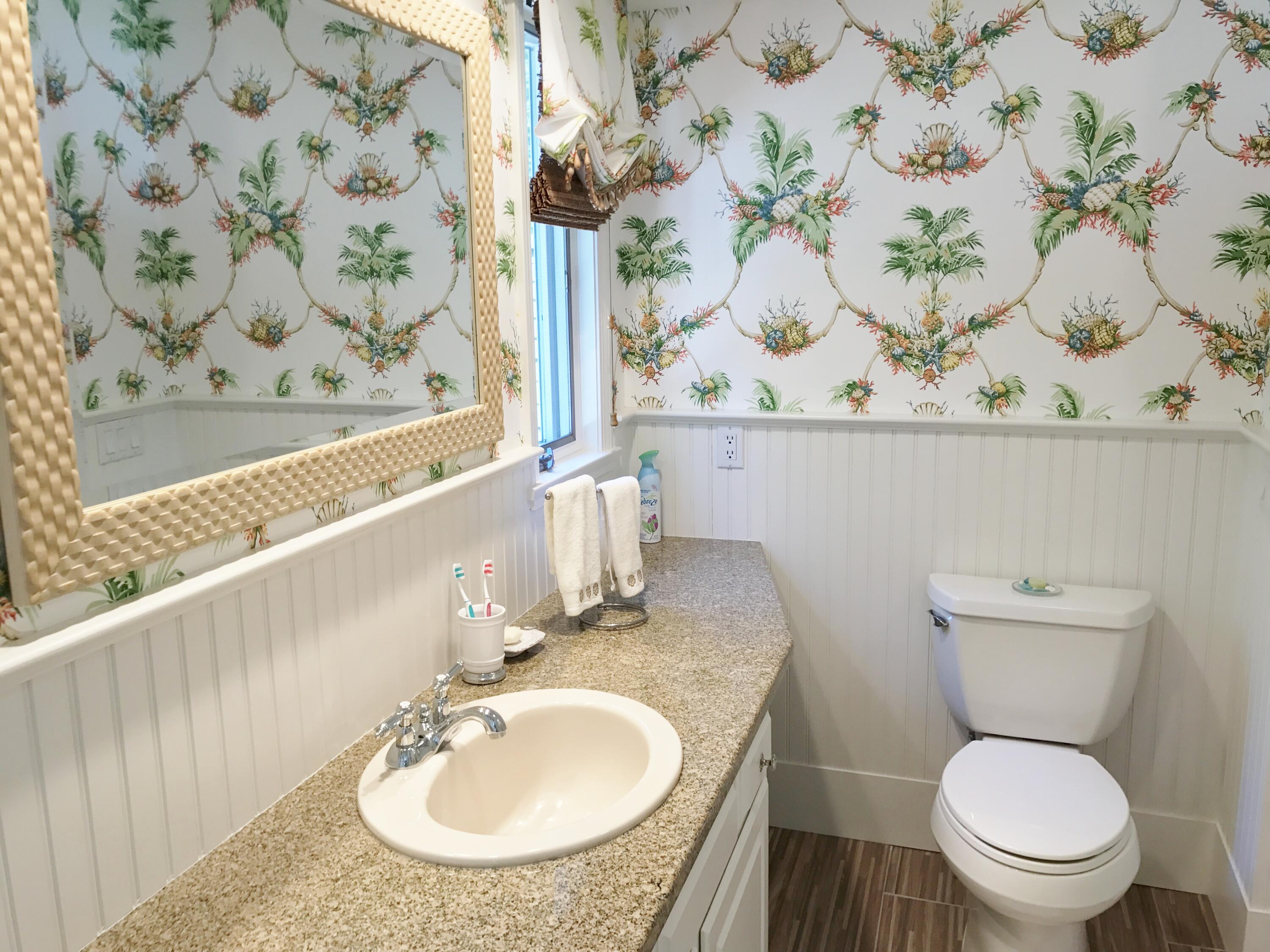 182 Sesuit Neck Road East Dennis, MA 02641 - Photo 31 of 35 a bathroom with a granite countertop sink and a toilet