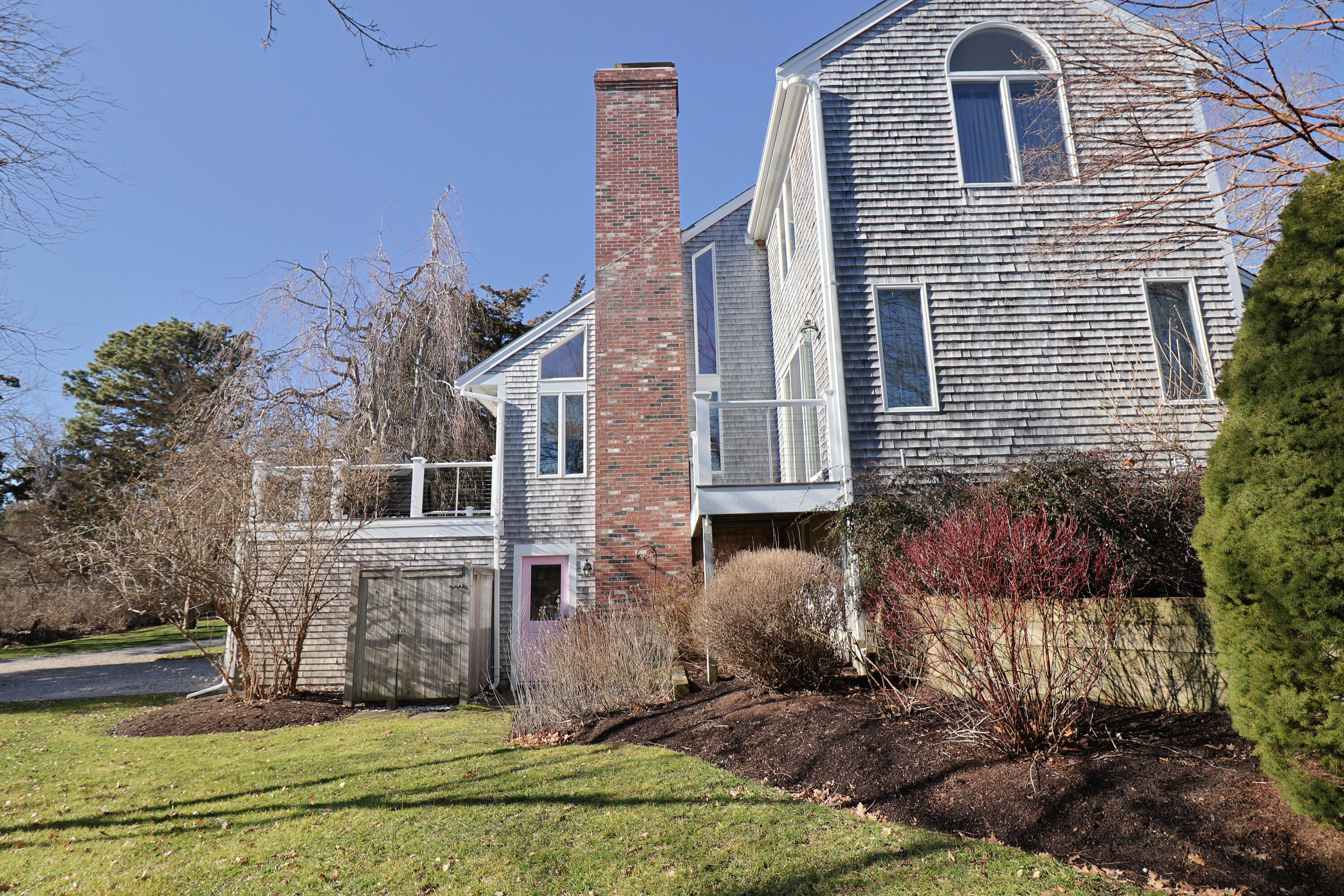 182 Sesuit Neck Road East Dennis, MA 02641 - Photo 34 of 35 a view of a house with a yard