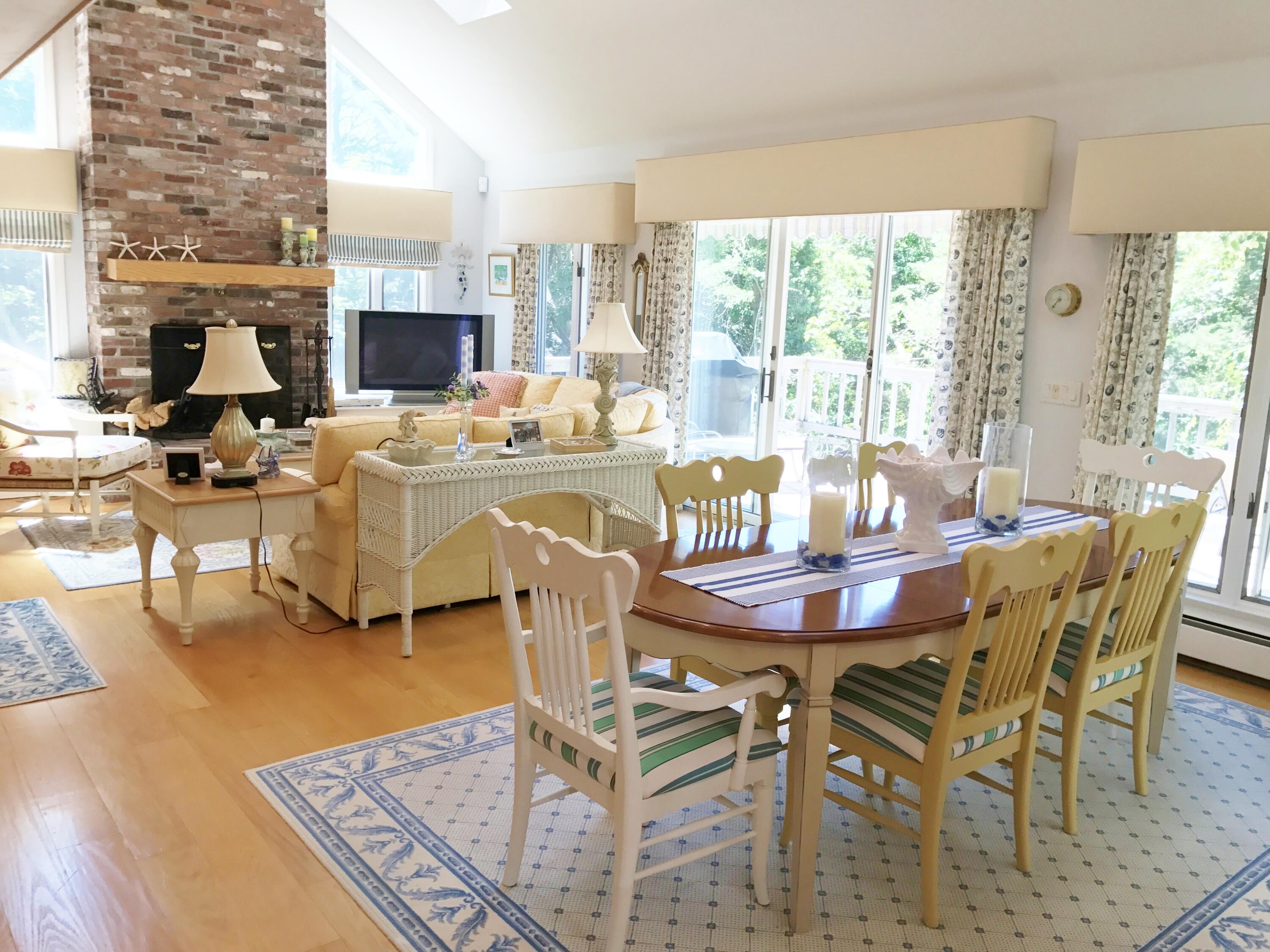 182 Sesuit Neck Road East Dennis, MA 02641 - Photo 5 of 35 a view of a dining room with furniture window and wooden floor