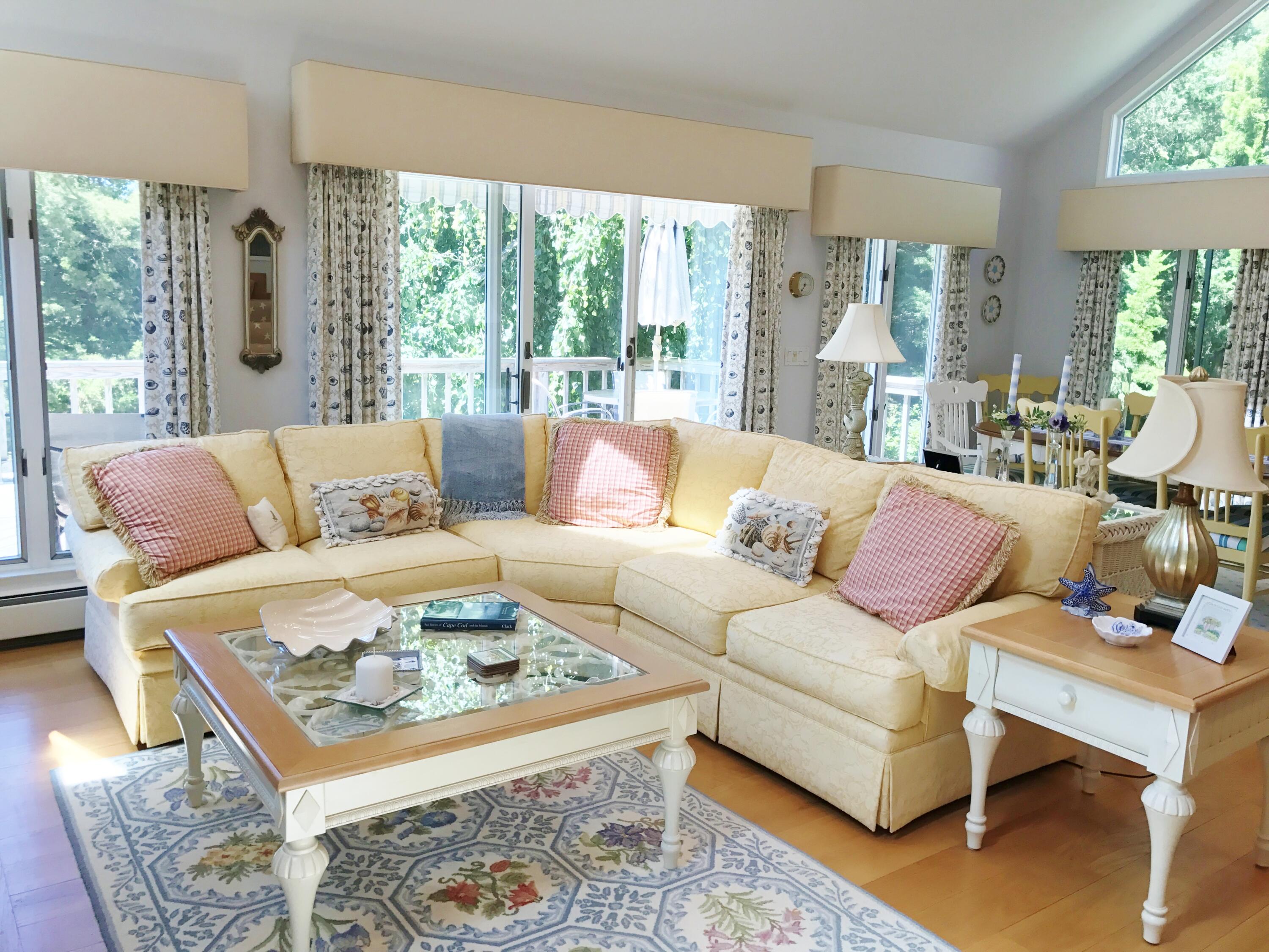 182 Sesuit Neck Road East Dennis, MA 02641 - Photo 7 of 35 a living room with furniture and a large window