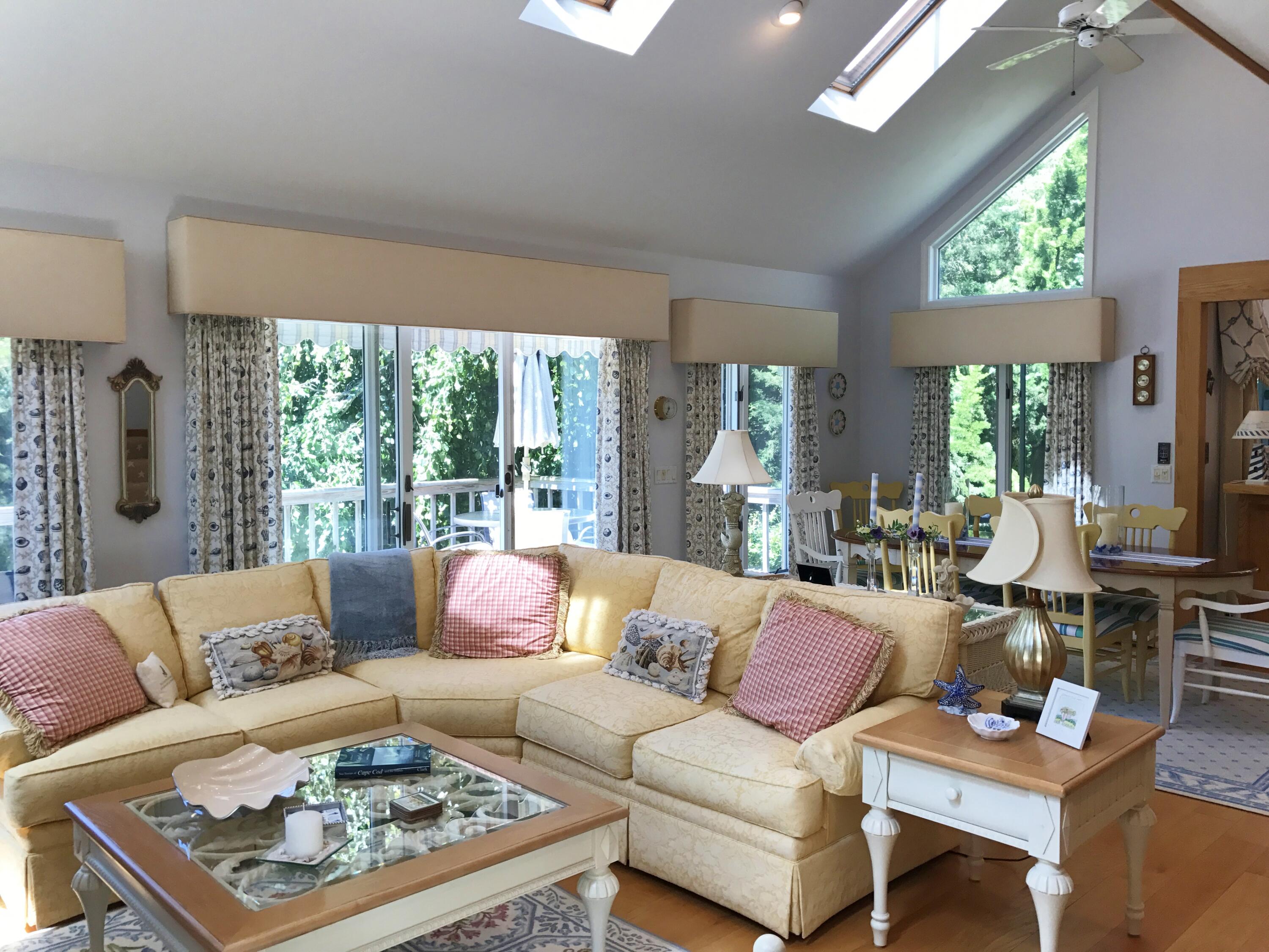 182 Sesuit Neck Road East Dennis, MA 02641 - Photo 8 of 35 a living room with furniture and a large window