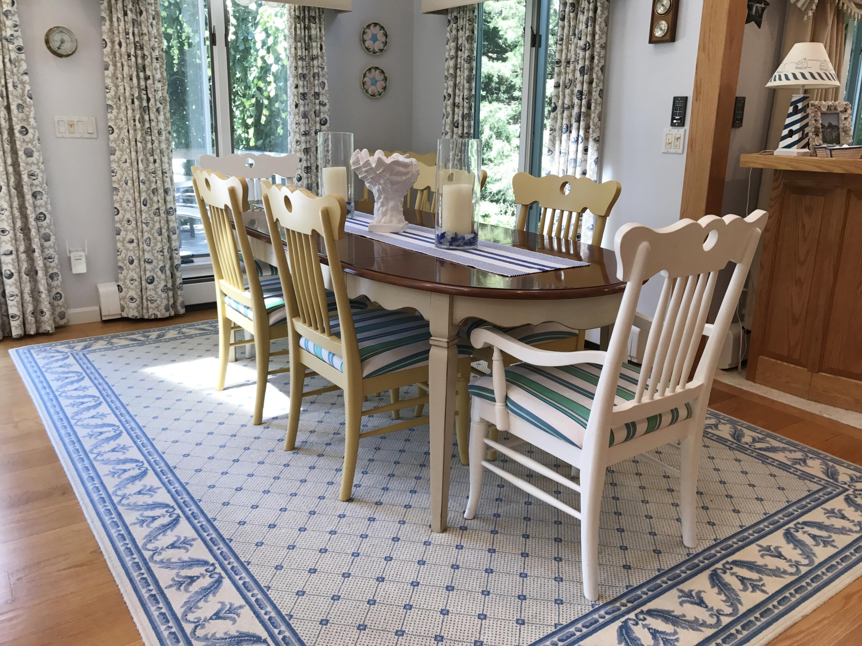 182 Sesuit Neck Road East Dennis, MA 02641 - Photo 9 of 35 a view of a dining room with furniture and wooden floor