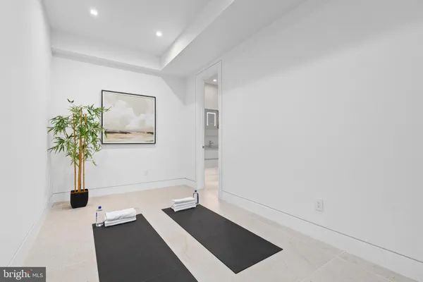 a picture of a room with a potted plant and a window