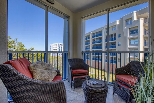 a view of a balcony with chair