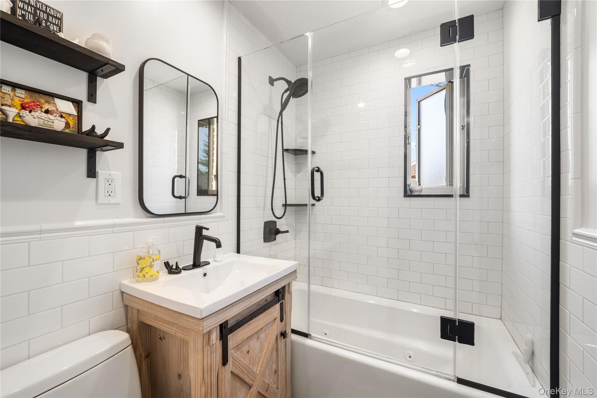 224-09 Manor Road, Unit LOWER) 2408 Queens, NY 11427 - Photo 18 of 20 a bathroom with a granite countertop sink toilet and shower